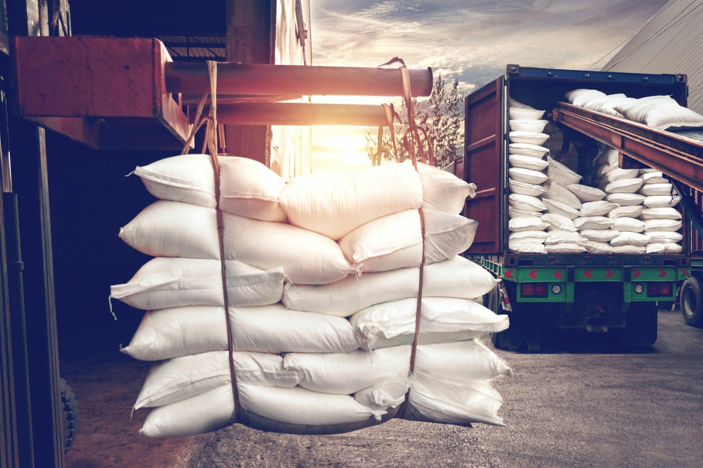 Sacks of milled product stacked on a pallet and loaded onto a truck at a warehouse